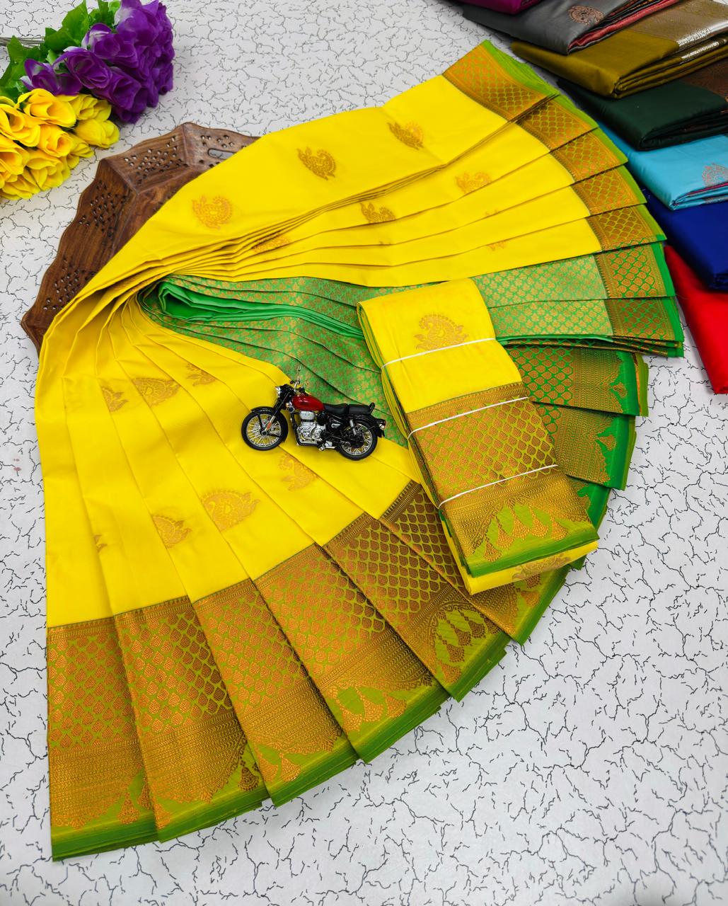 Yellow Paisley Butta Kanchi Border Soft Silk Saree